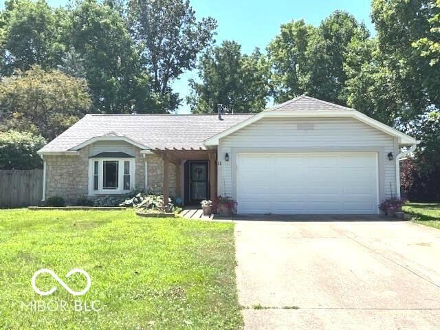 11 Mccutcheon Dr, Lafayette, IN 47909 - single story home featuring stone siding, an attached garage, concrete driveway, and a shingled roof