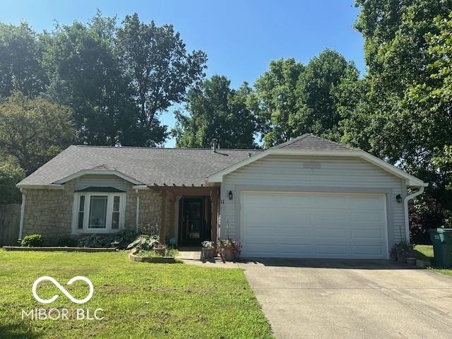 11 Mccutcheon Dr, Lafayette, IN 47909 - single story home with concrete driveway, stone siding, a front yard, and a garage