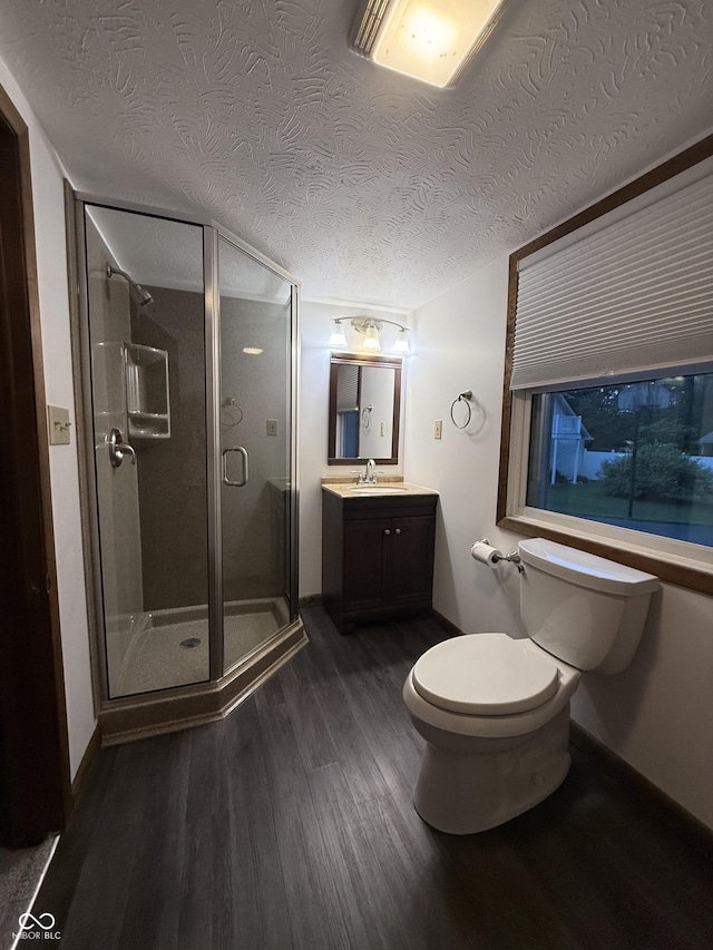 11698 N Bethesda Rd, Mooresville, IN 46158 - bathroom featuring wood finished floors, vanity, a stall shower, and a textured ceiling