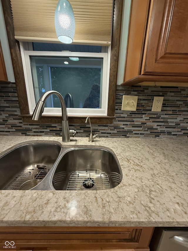 11698 N Bethesda Rd, Mooresville, IN 46158 - kitchen view of backsplash, brown cabinetry, and light stone counters