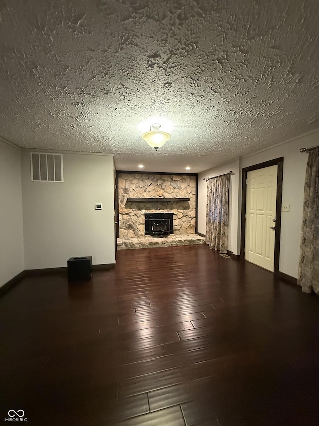 11698 N Bethesda Rd, Mooresville, IN 46158 - unfurnished living room with a fireplace, a textured ceiling, and wood finished floors