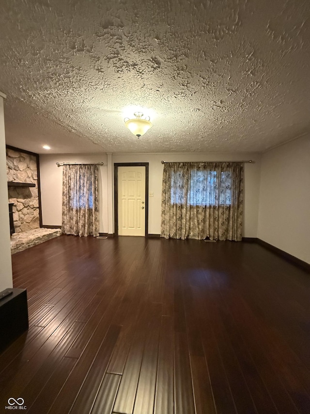 11698 N Bethesda Rd, Mooresville, IN 46158 - unfurnished living room with a textured ceiling and hardwood / wood-style flooring