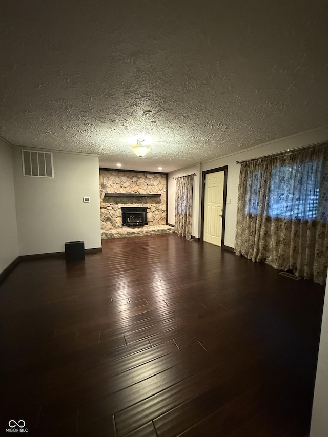 11698 N Bethesda Rd, Mooresville, IN 46158 - unfurnished living room with a textured ceiling, wood finished floors, and a fireplace