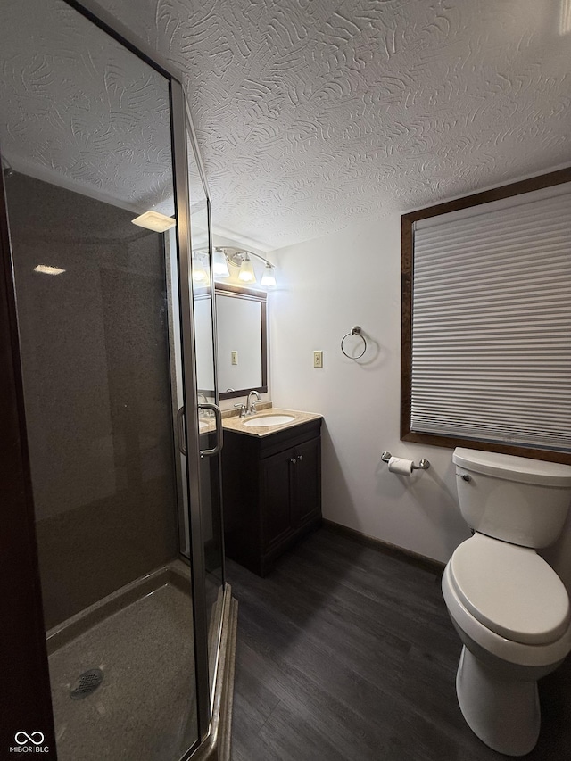 11698 N Bethesda Rd, Mooresville, IN 46158 - full bath featuring wood finished floors, vanity, a stall shower, and a textured ceiling