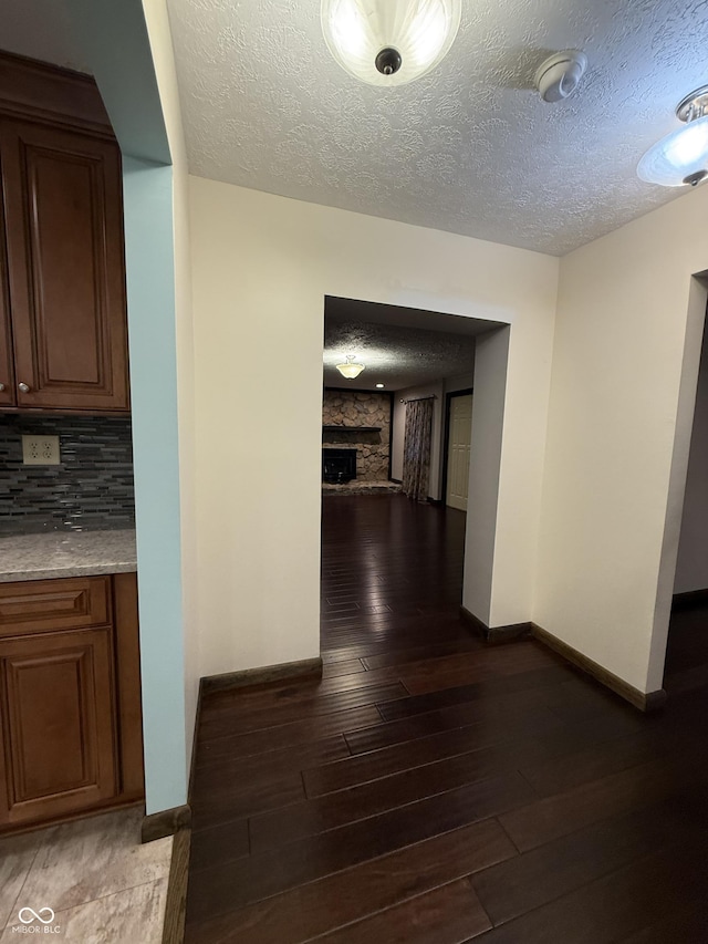 11698 N Bethesda Rd, Mooresville, IN 46158 - hallway featuring a textured ceiling and dark wood-style flooring