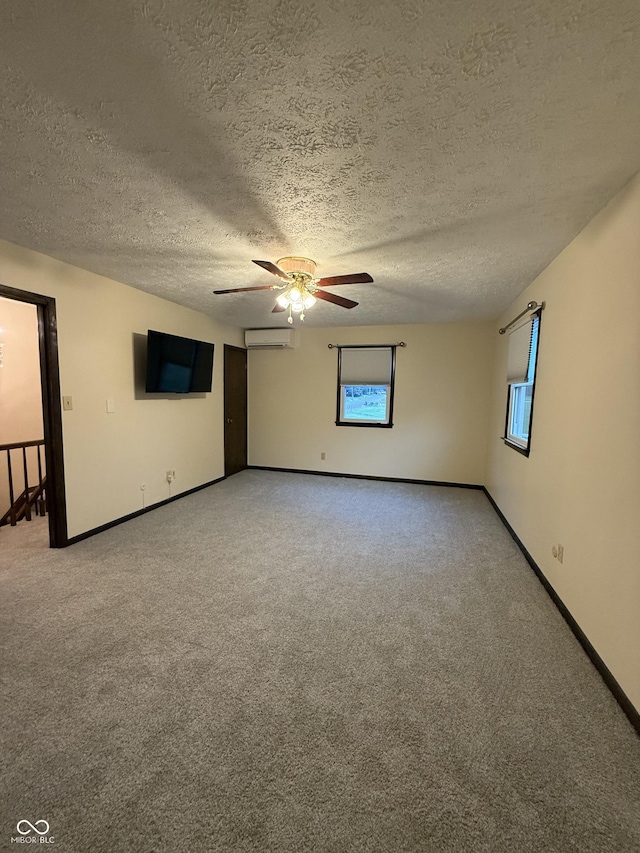 11698 N Bethesda Rd, Mooresville, IN 46158 - unfurnished room with carpet, ceiling fan, a textured ceiling, plenty of natural light, and a wall unit AC