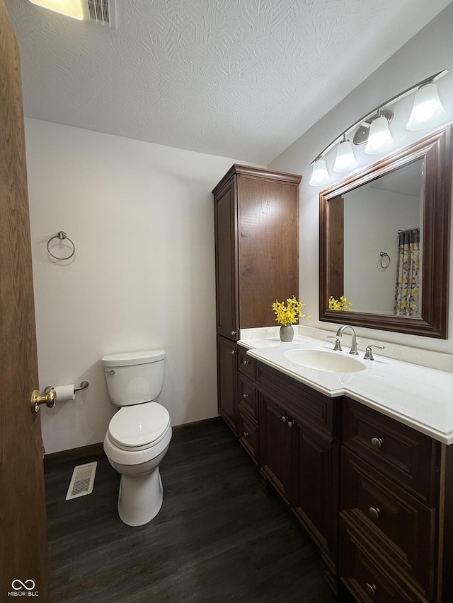 11698 N Bethesda Rd, Mooresville, IN 46158 - full bathroom with vanity, wood finished floors, and a textured ceiling