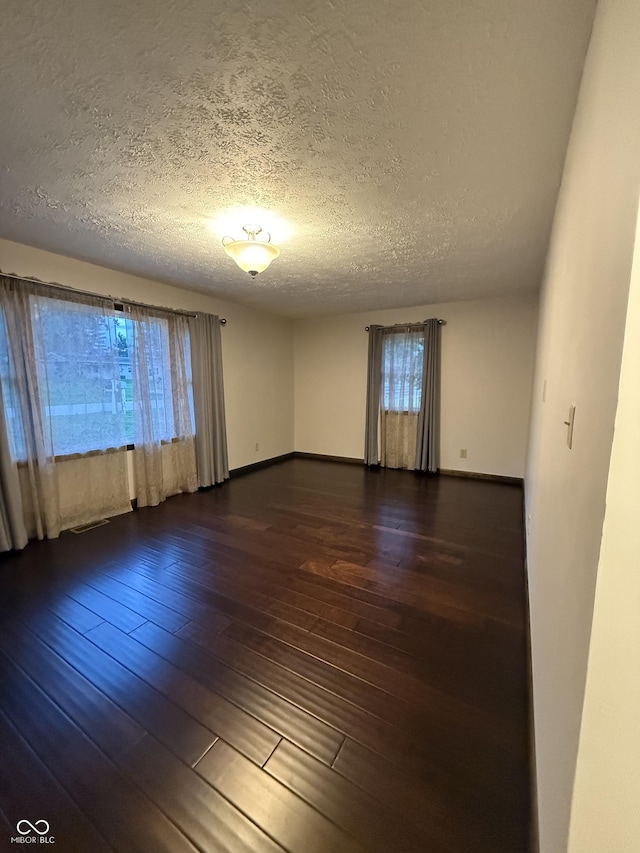 11698 N Bethesda Rd, Mooresville, IN 46158 - spare room featuring wood-type flooring and a textured ceiling