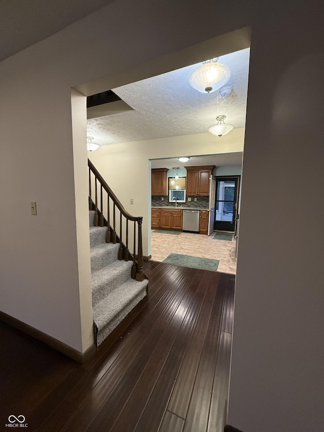 11698 N Bethesda Rd, Mooresville, IN 46158 - stairway with wood finished floors and a textured ceiling