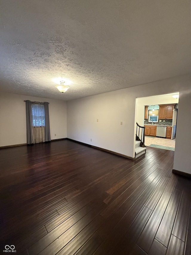 11698 N Bethesda Rd, Mooresville, IN 46158 - unfurnished room featuring stairway, dark wood-style floors, and a textured ceiling