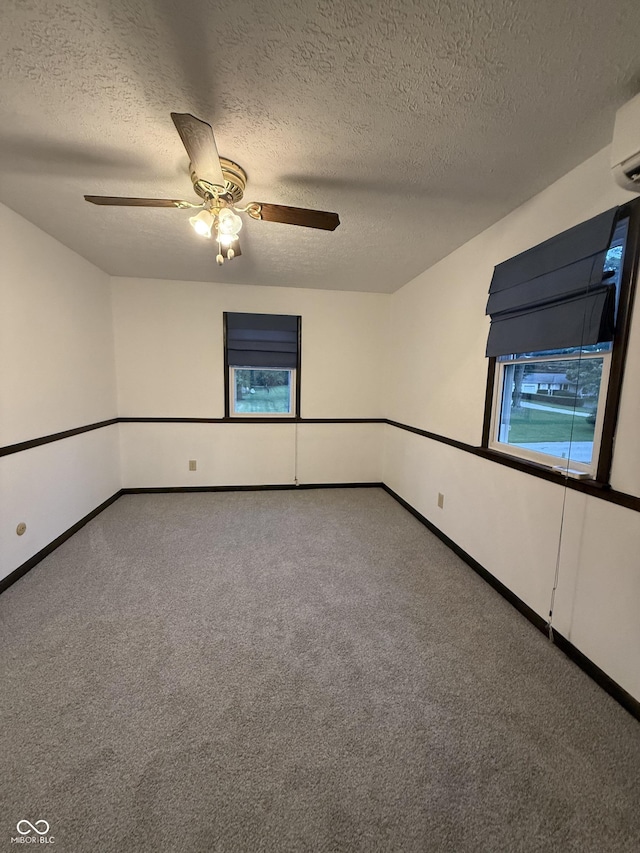 11698 N Bethesda Rd, Mooresville, IN 46158 - carpeted empty room featuring ceiling fan, a textured ceiling, and a wall mounted air conditioner