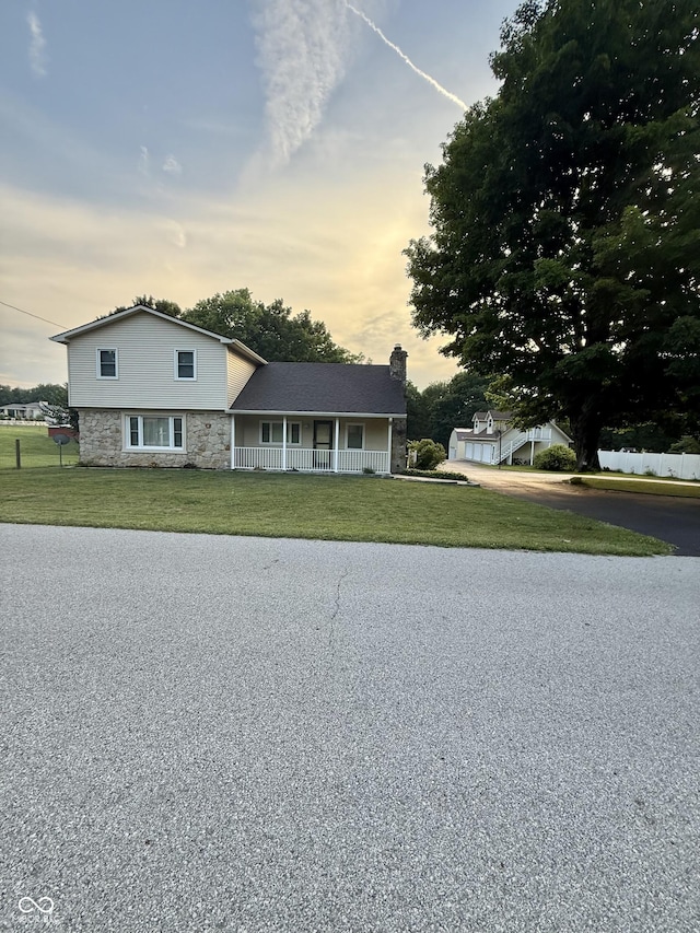 11698 N Bethesda Rd, Mooresville, IN 46158 - view of front of house with a front lawn, covered porch, and stone siding