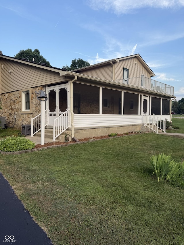 11698 N Bethesda Rd, Mooresville, IN 46158 - view of front of house with a sunroom, a front yard, and a balcony