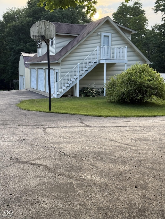11698 N Bethesda Rd, Mooresville, IN 46158 - view of front of property with stairway, a shingled roof, and a lawn