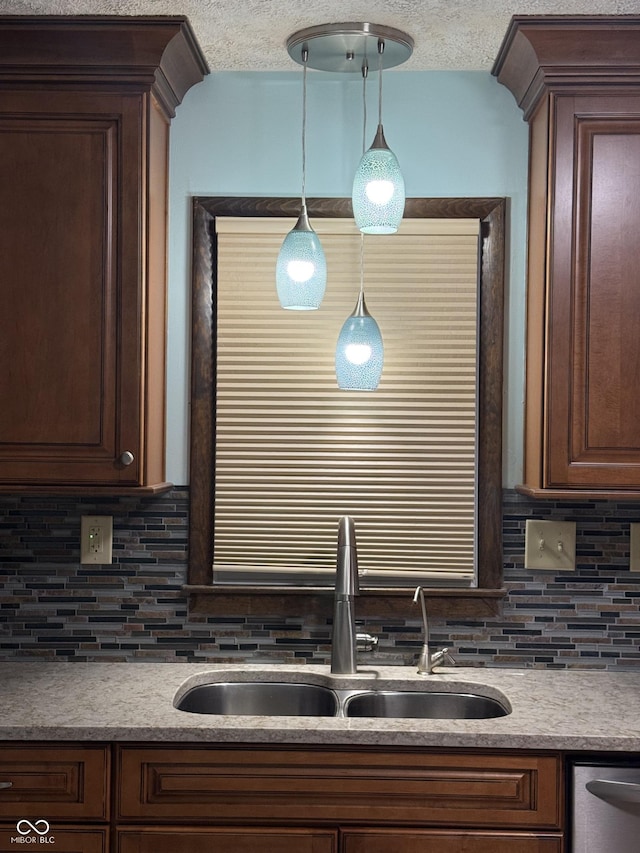 11698 N Bethesda Rd, Mooresville, IN 46158 - kitchen featuring backsplash, stainless steel dishwasher, pendant lighting, dark brown cabinetry, and a textured ceiling