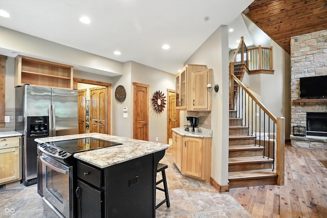 7563 Grizzly Dr, Nineveh, IN 46164 - kitchen with appliances with stainless steel finishes, light brown cabinets, a fireplace, a center island, and open shelves