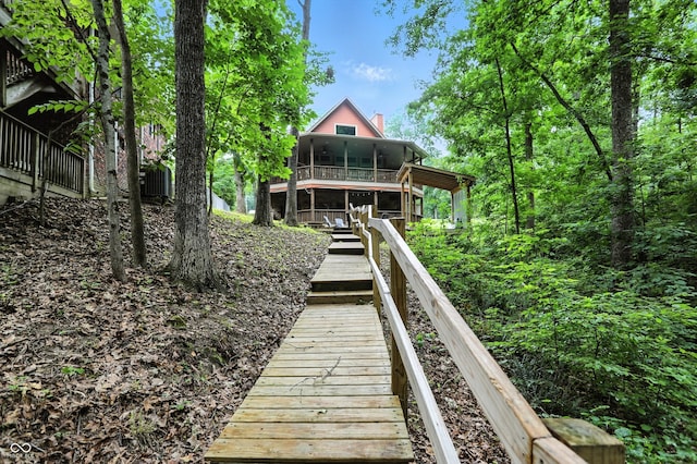 7563 Grizzly Dr, Nineveh, IN 46164 - rear view of house with a chimney and a sunroom