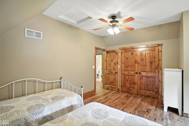 7563 Grizzly Dr, Nineveh, IN 46164 - bedroom featuring hardwood / wood-style flooring, vaulted ceiling, and a ceiling fan