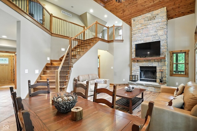 7563 Grizzly Dr, Nineveh, IN 46164 - dining space featuring high vaulted ceiling, wood finished floors, stairs, healthy amount of natural light, and wood ceiling