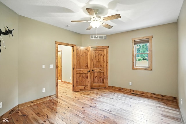 7563 Grizzly Dr, Nineveh, IN 46164 - unfurnished bedroom with light wood-type flooring and ceiling fan