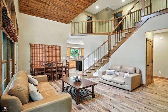 7563 Grizzly Dr, Nineveh, IN 46164 - living room with high vaulted ceiling, light wood-style flooring, stairway, and recessed lighting