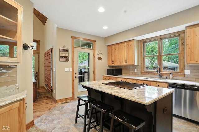 7563 Grizzly Dr, Nineveh, IN 46164 - kitchen with dishwasher, black microwave, tasteful backsplash, recessed lighting, and a breakfast bar