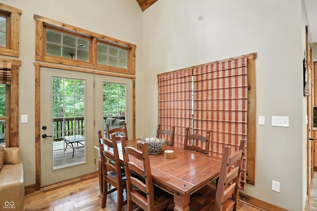 7563 Grizzly Dr, Nineveh, IN 46164 - dining space with light wood-style flooring and a towering ceiling