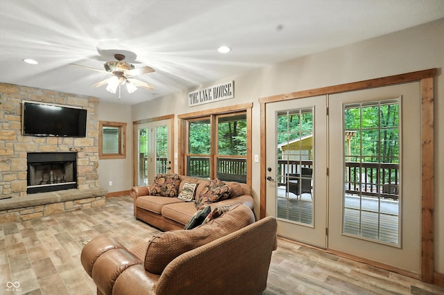 7563 Grizzly Dr, Nineveh, IN 46164 - living area featuring wood finished floors, ceiling fan, a stone fireplace, and recessed lighting
