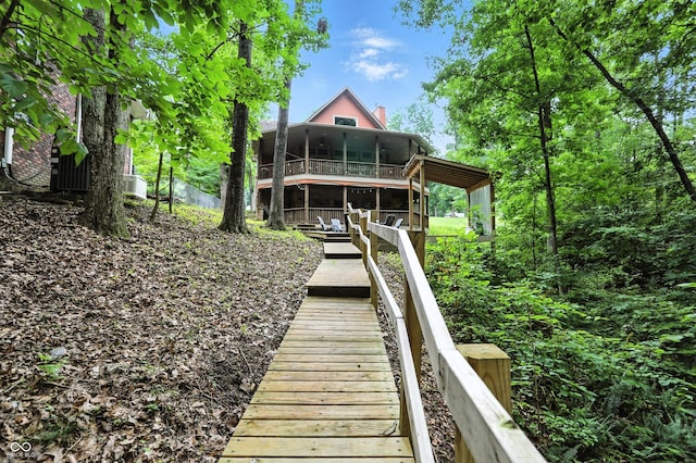 7563 Grizzly Dr, Nineveh, IN 46164 - back of house with a sunroom and a chimney