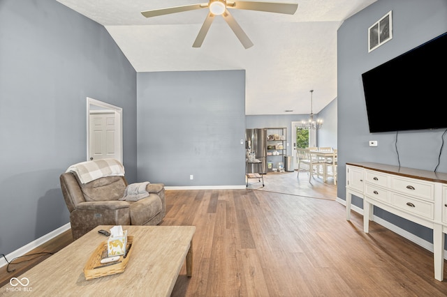3914 Chenango Pl, West Lafayette, IN 47906 - living room with a chandelier, ceiling fan, wood finished floors, and high vaulted ceiling