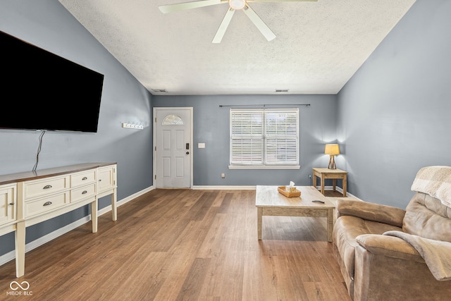 3914 Chenango Pl, West Lafayette, IN 47906 - living area featuring a textured ceiling, a ceiling fan, and wood finished floors