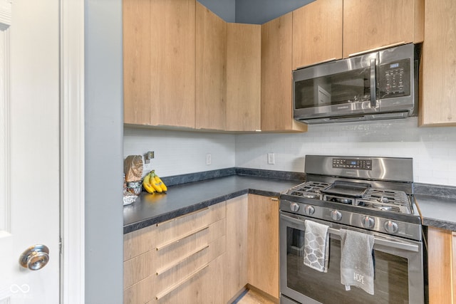 3914 Chenango Pl, West Lafayette, IN 47906 - kitchen featuring appliances with stainless steel finishes, light brown cabinets, and dark countertops