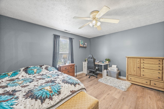 3914 Chenango Pl, West Lafayette, IN 47906 - bedroom with wood finished floors, a textured ceiling, ceiling fan, and an office area