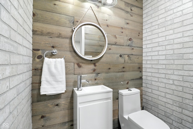 8138 Harrison Dr, Lawrence, IN 46226 - half bath featuring vanity and wood walls