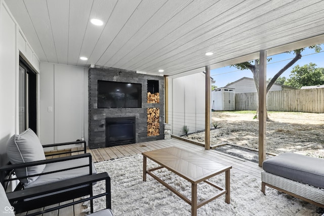 8138 Harrison Dr, Lawrence, IN 46226 - living area with a large fireplace, recessed lighting, and hardwood / wood-style flooring