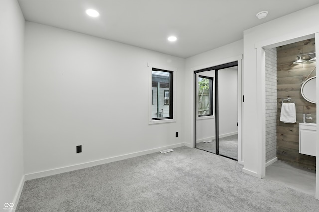 8138 Harrison Dr, Lawrence, IN 46226 - unfurnished bedroom featuring carpet, recessed lighting, and ensuite bathroom