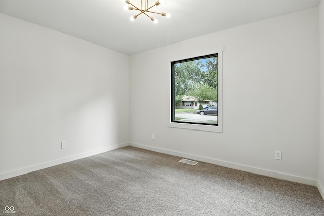 8138 Harrison Dr, Lawrence, IN 46226 - carpeted empty room with a chandelier and baseboards