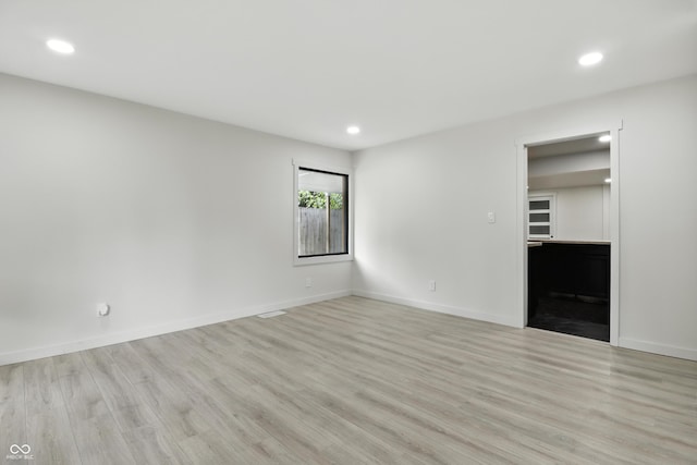 8138 Harrison Dr, Lawrence, IN 46226 - unfurnished living room featuring recessed lighting and light wood finished floors