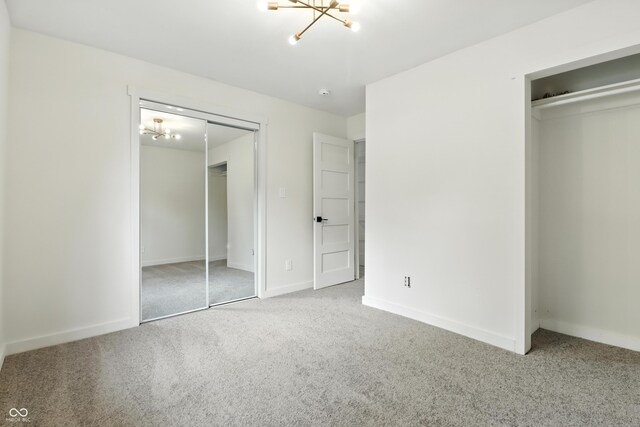 8138 Harrison Dr, Lawrence, IN 46226 - unfurnished bedroom with a chandelier, carpet flooring, and a closet
