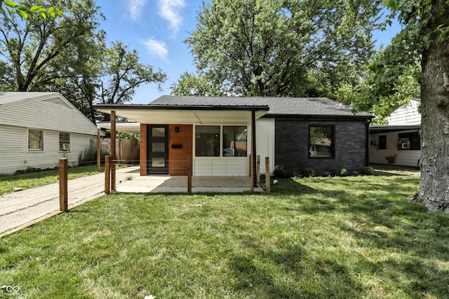 8138 Harrison Dr, Lawrence, IN 46226 - rear view of property featuring a shingled roof, a carport, and driveway
