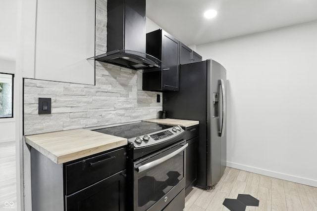 8138 Harrison Dr, Lawrence, IN 46226 - kitchen featuring electric range, island exhaust hood, dark cabinets, and tasteful backsplash