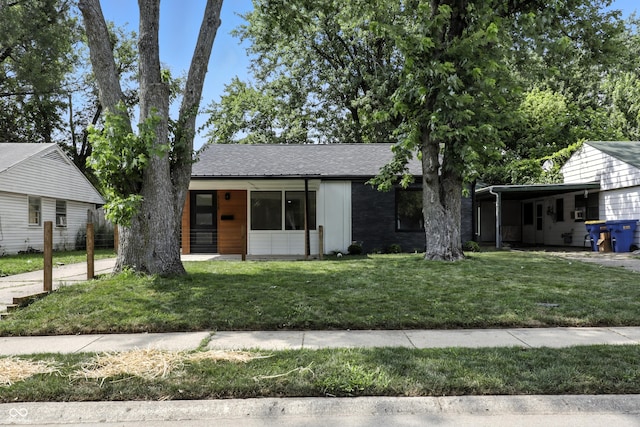 8138 Harrison Dr, Lawrence, IN 46226 - single story home featuring a front lawn and a shingled roof