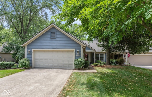8048 River Bay Dr E, Indianapolis, IN 46240 - single story home featuring driveway, a front lawn, and a garage