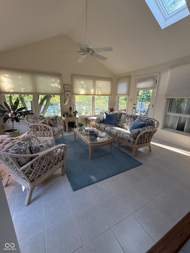 8048 River Bay Dr E, Indianapolis, IN 46240 - living area with tile patterned floors, a skylight, ceiling fan, and high vaulted ceiling