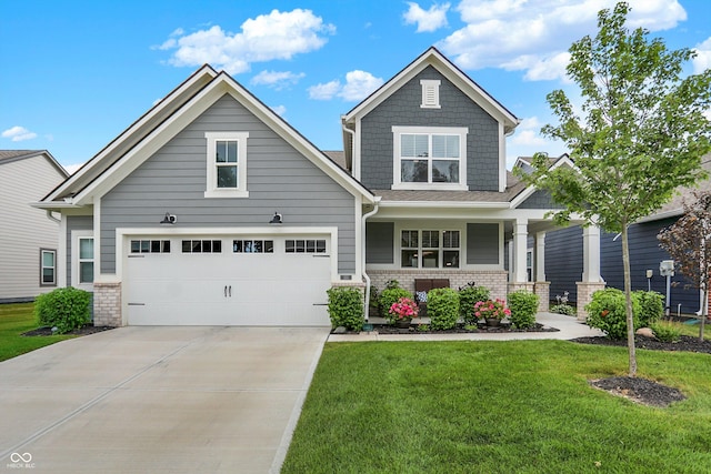 355 Ehrlich Ln, Westfield, IN 46074 - craftsman-style house with a front lawn, covered porch, driveway, and a garage