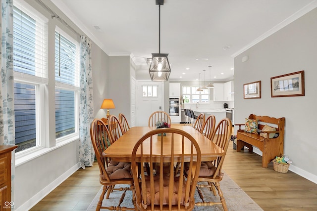 355 Ehrlich Ln, Westfield, IN 46074 - dining space with light wood finished floors, crown molding, and recessed lighting