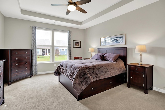 355 Ehrlich Ln, Westfield, IN 46074 - bedroom with light colored carpet, a raised ceiling, and a ceiling fan