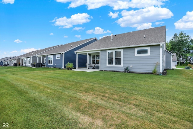 355 Ehrlich Ln, Westfield, IN 46074 - back of property with a patio, a lawn, and roof with shingles