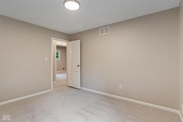 10184 Lakeshore Dr E, Carmel, IN 46033 - spare room featuring light colored carpet and baseboards