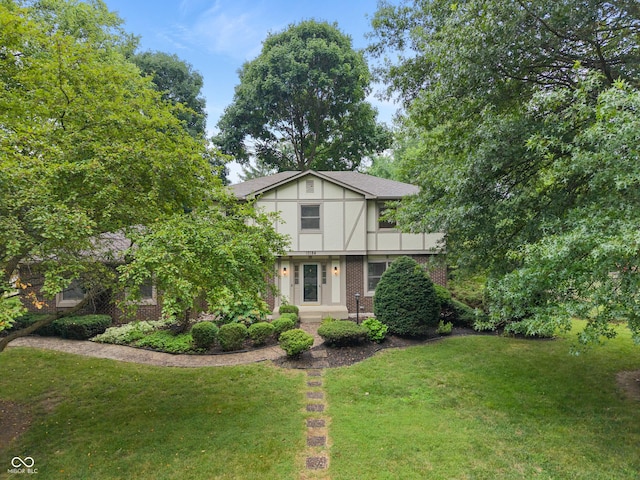 10184 Lakeshore Dr E, Carmel, IN 46033 - english style home featuring a front yard and brick siding